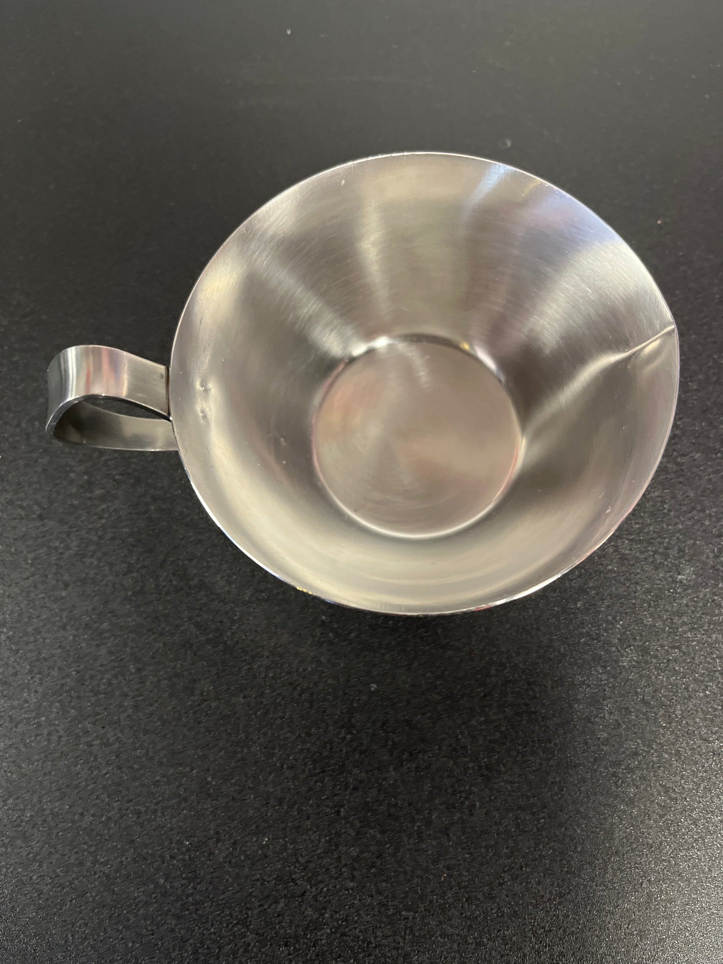 Sleek Stainless Steel Creamer Cup with Scroll Handle