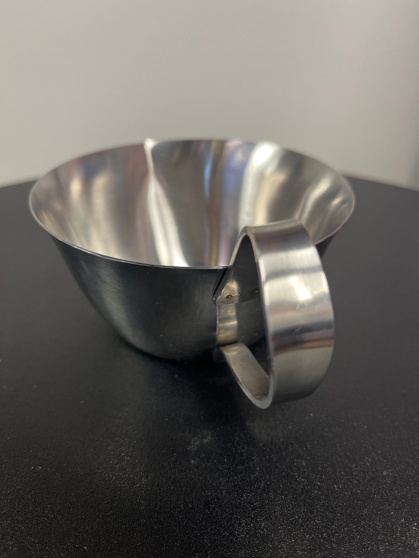 Sleek Stainless Steel Creamer Cup with Scroll Handle