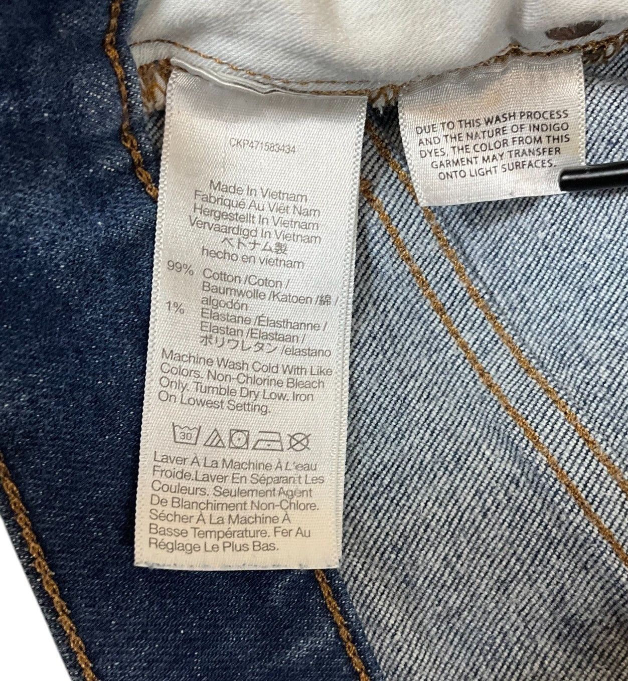 Madewell jeans fabric content and care label showing 99 percent cotton and 1 percent elastane